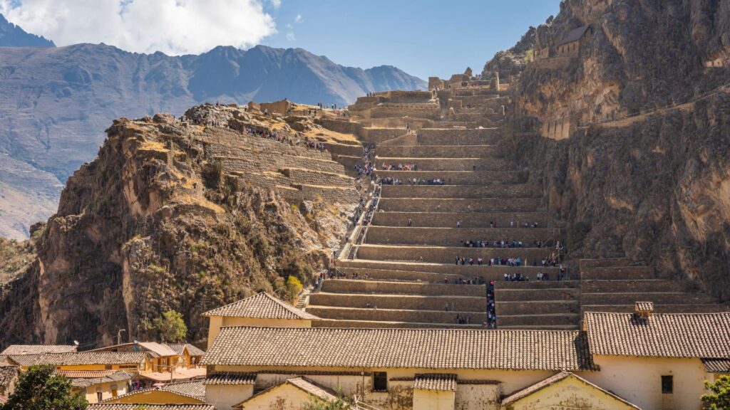 Panoramic view of ancient Inca terraces at Ollantaytambo archaeological site in Sacred Valley during a Cusco Classic Tour 4 Days - Aremika Travel
